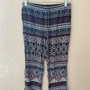 Pink, teal, black and white patterned pants.